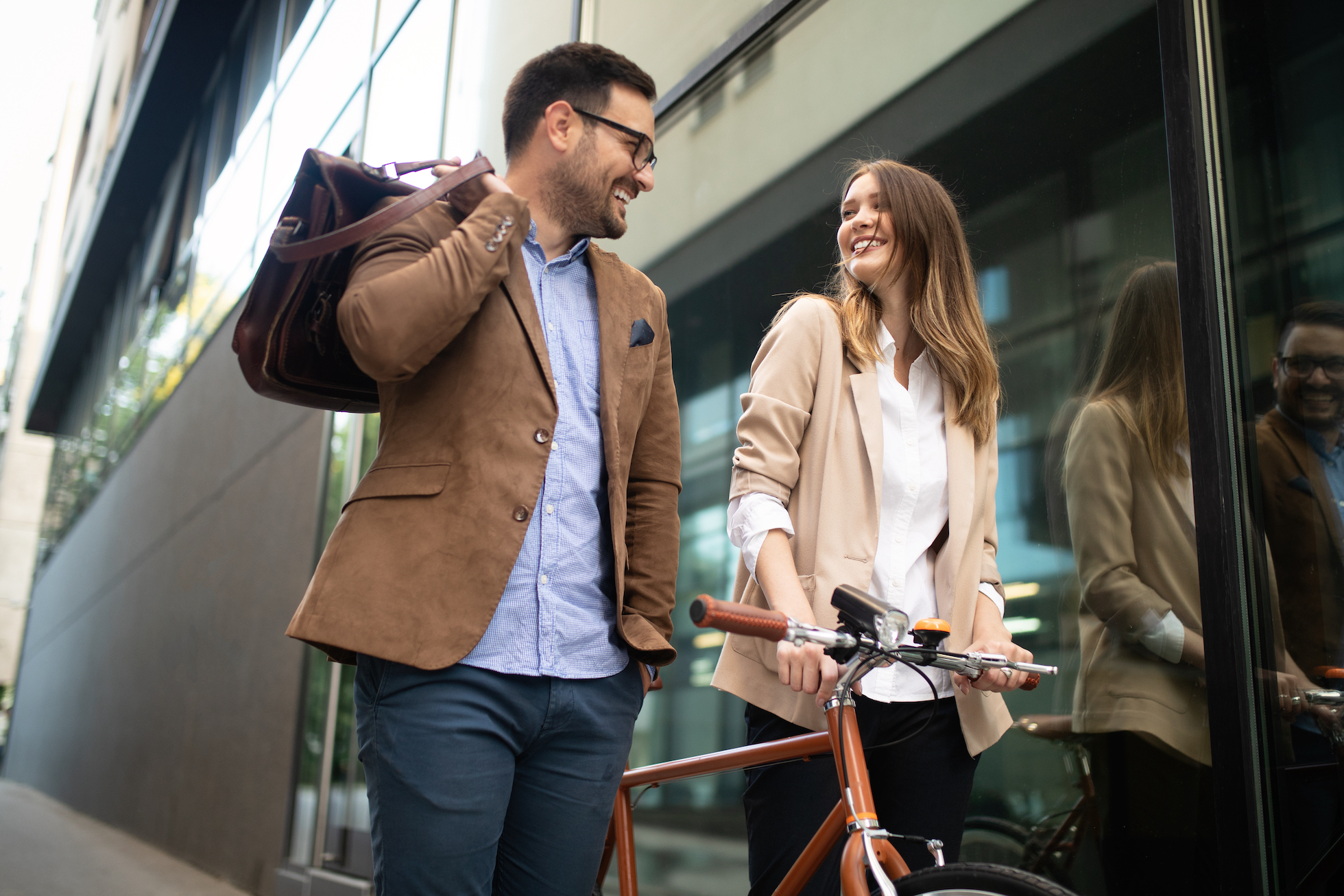 Office woman with business man couple enjoying break while talking flirting outdoor